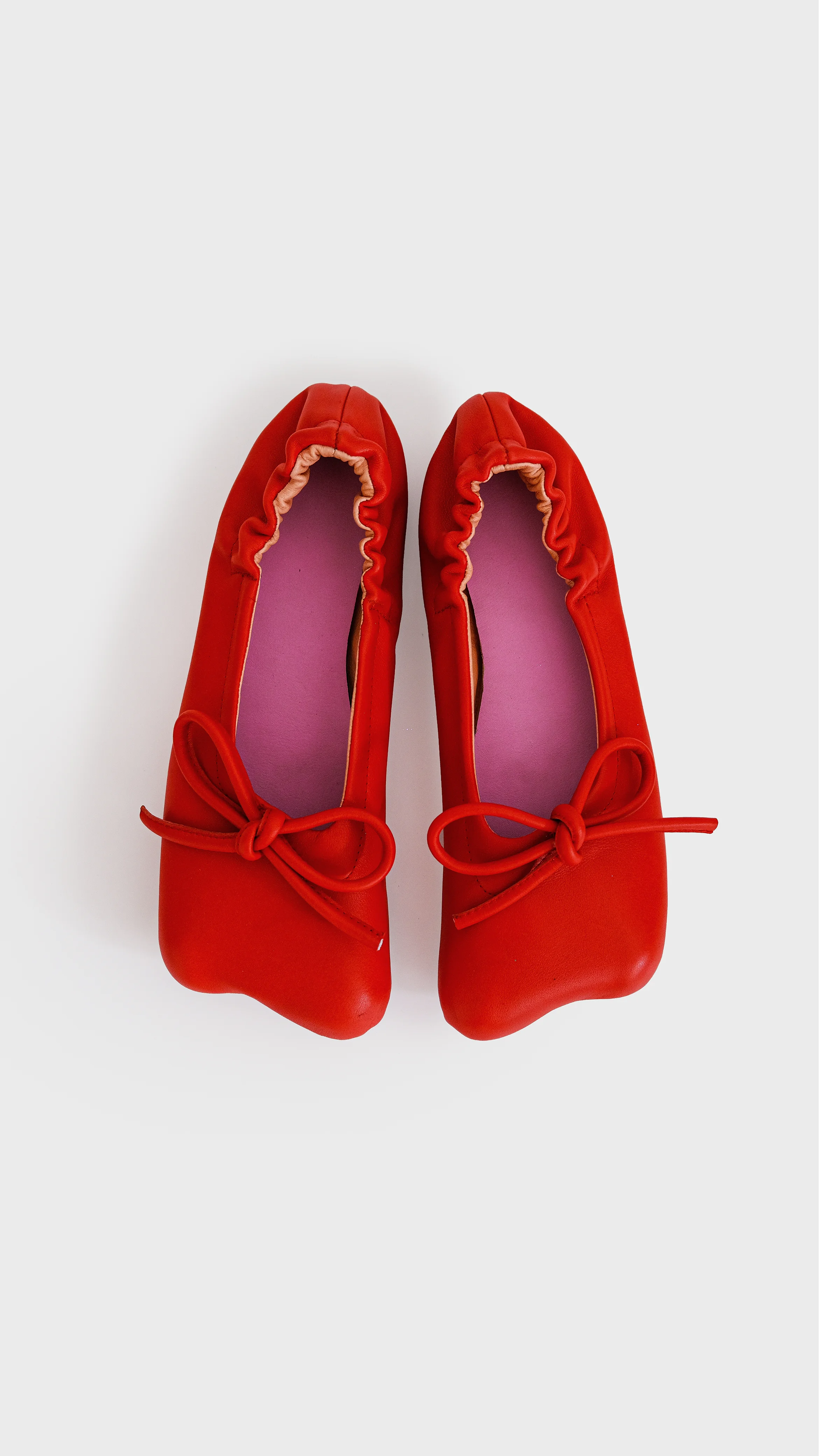 Red ballerinas flat view